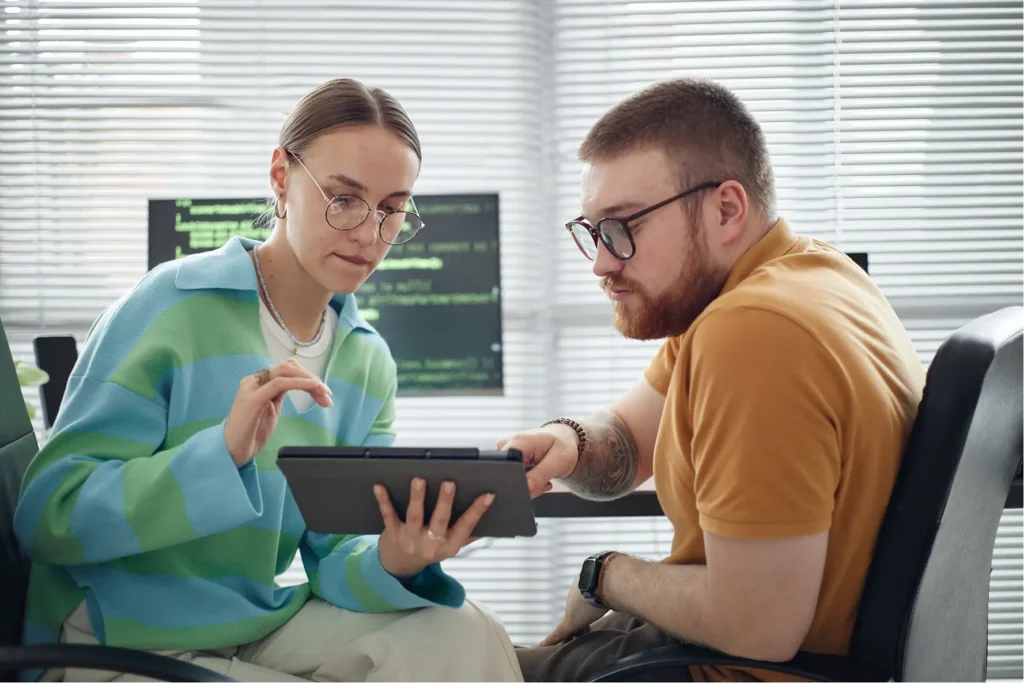 coworkers collaborate using a tablet in office 2026 01 09 12 09 45 utc 1
